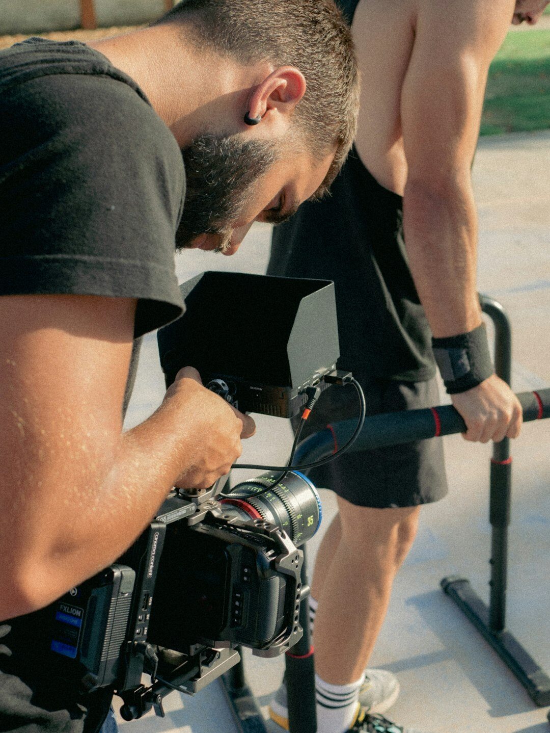 Video production crew preparing camera equipment for a live report
