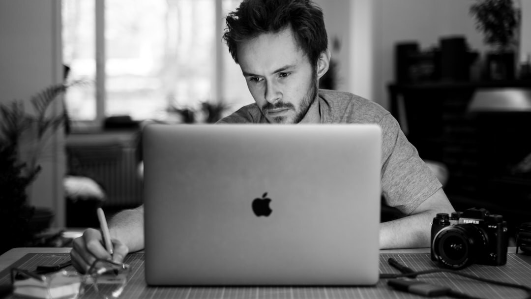 Portrait of a Belgian man, data monitoring specialist, hoodie under blazer